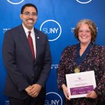 A photo of Stephanie Weinman (right) and SUNY Chancellor John B. King Jr.