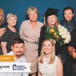 Photo of a family at graduation, with a graphic overlay reading Graduation 2025 with the Empire State University and University of New York Prague logos.
