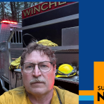 A photo of a person with glasses set against a fire truck, with a SUNY Empire News graphic framing it.