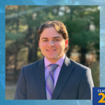 Graphic with a blue-toned background featuring a portrait of Stephen Bernhardt in a suit and tie, smiling outdoors. A SUNY Empire shield logo appears in the top left, and “Class of 2026” appears in the bottom right with a graduation cap icon.